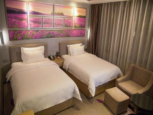 Posteľ alebo postele v izbe v ubytovaní Lavande Hotel Longnan Changjiang River Avenue