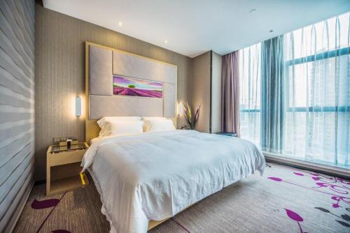 Krevet ili kreveti u jedinici u objektu Lavande Hotel Chongqing Tongliang Wanda Plaza Gas Tower