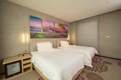 Krevet ili kreveti u jedinici u objektu Lavande Hotel Dongguan Humen Wanda Square
