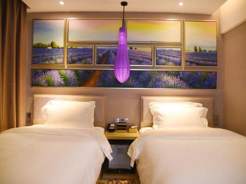 Postel nebo postele na pokoji v ubytování Lavande Hotel Zhanjiang Xuwen Tianrunhui