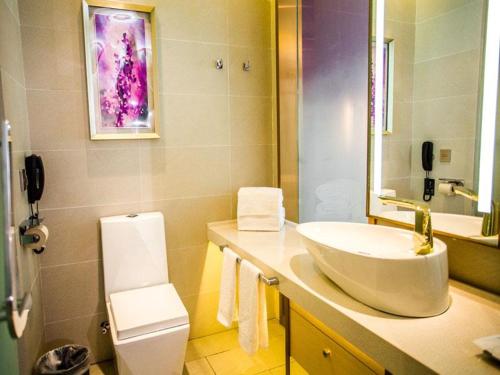 a bathroom with a sink and a toilet at Lavande Hotel Yanan Pagoda Mountain in Yan'an