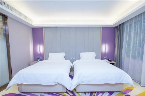 Katil atau katil-katil dalam bilik di Lavande Hotel Lanzhou Chengguan Bridge