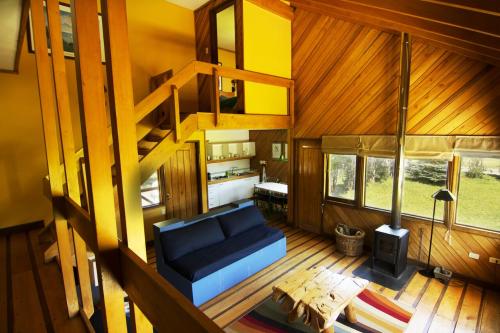 an overhead view of a living room with a blue couch at Yelcho en la Patagonia in Chaitén