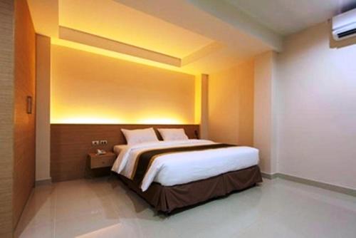 Postel nebo postele na pokoji v ubytování Gateway Hotel Pratunam