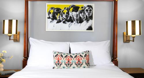 a bed with a picture of a woman on it at White Swan Inn in San Francisco