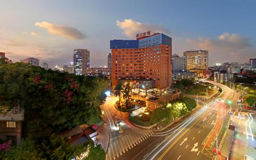 a view of a city at night with buildings at City Hotel Xiamen-Free Welcome Fruits in Xiamen