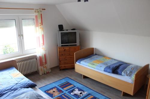 Postel nebo postele na pokoji v ubytování Fewo Wulkje Emden