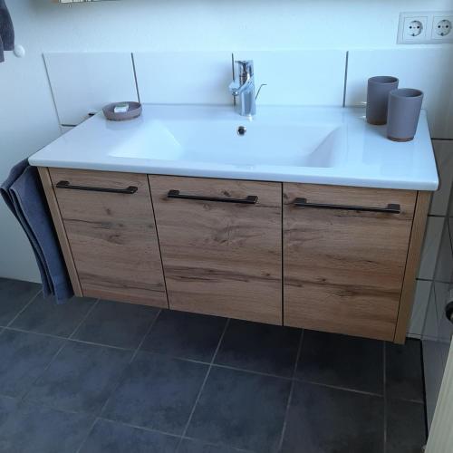 a bathroom sink with a white counter top at Am Badischen Weinberg in Hagnau