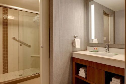 a bathroom with a sink and a shower at Hyatt Place Indianapolis Fishers in Fishers
