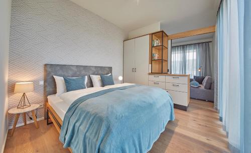 Postel nebo postele na pokoji v ubytování Hermitage Apartments