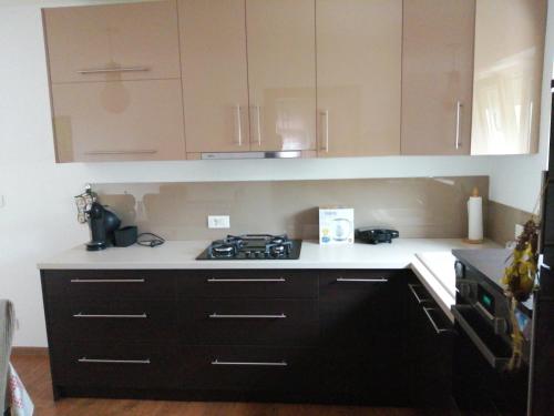 a kitchen with a stove and white counter top at Valnea in Viskovo