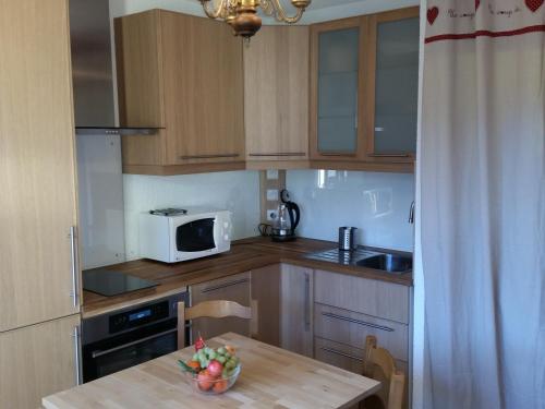 Kuchyň nebo kuchyňský kout v ubytování Appartement de vacances
