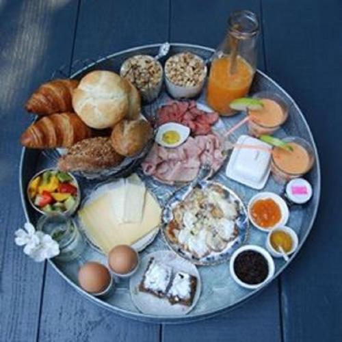 a tray of breakfast foods on a table at Ontbijt bij De Boerenmeid in Hoogwoud