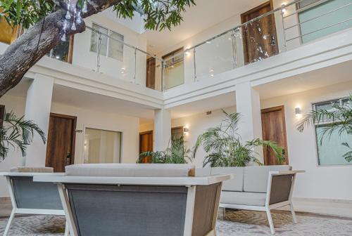 an empty lobby with plants in a building at Cartagena Royal Hotel Boutique in Cartagena de Indias