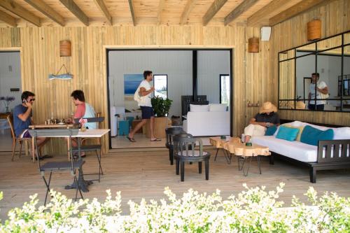 a group of people sitting in a living room at Casa Flor in Punta del Este