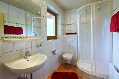 a bathroom with a sink and a shower and a toilet at Appartement Gisela in Sölden