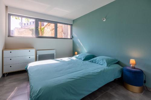 Posteľ alebo postele v izbe v ubytovaní Le 21 -GregIMMO-Appart'Hôtel