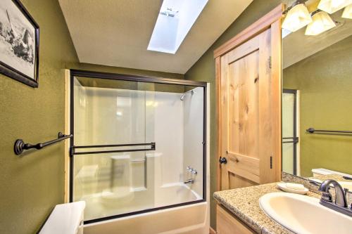 a bathroom with a shower and a sink at Lakefront Eatonville Cabin w/ Dock & Mtn Views! in Mineral