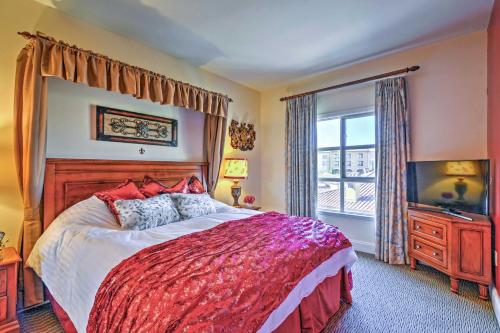 a bedroom with a large bed and a television at Luxury Lake Las Vegas Condo with Resort Amenities! in Las Vegas