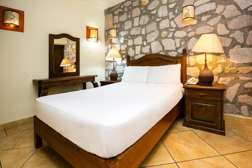 Postel nebo postele na pokoji v ubytování Hotel Casa del Virrey & Suites