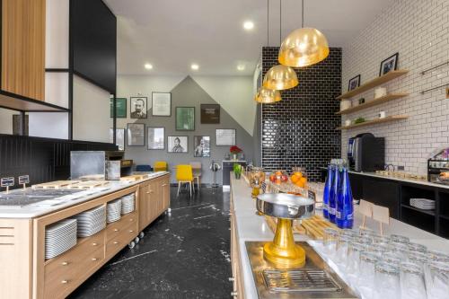 a kitchen with a counter with glasses on it at Holiday Inn Madrid - Las Tablas by IHG in Madrid