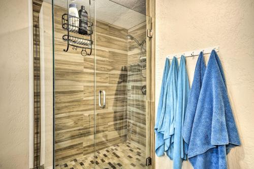 a bathroom with a shower with blue towels at Charming Kelso Home with Proximity to Cowlitz River! in Kelso