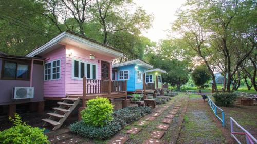 a row of modular homes in a park at Goldengold (Khaoyai) Resort & Spa in Mu Si