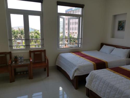 Postelja oz. postelje v sobi nastanitve An Ngân Phú Hotel