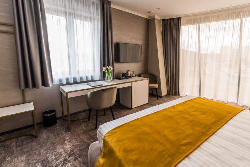Postel nebo postele na pokoji v ubytování Hotel Aventus