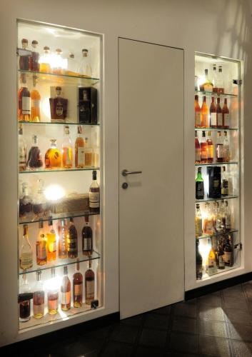 a refrigerator filled with lots of bottles of alcohol at Hotel Marina Riviera in Amalfi