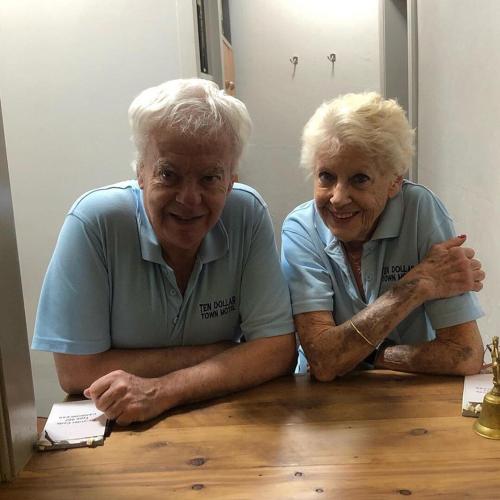 two older women sitting at a wooden table at Ten Dollar Town Motel in Gulgong