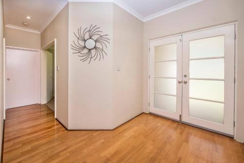 an empty room with a closet and a door at Macs Manor in Dunsborough