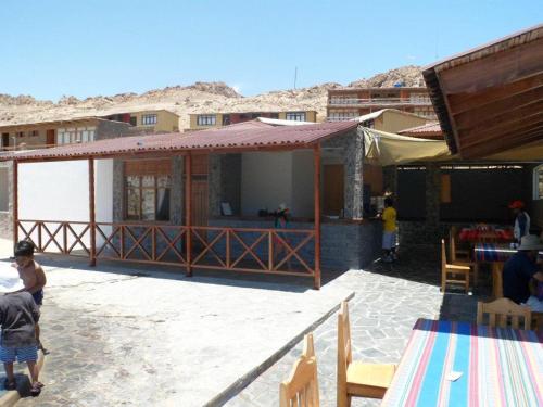 a group of people standing outside of a building at Hotel Puerto Inka in Chala