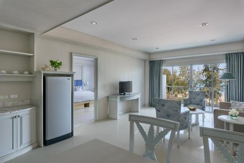 a living room with a kitchen and a dining room at Seapine Beach Golf and Resort Hua Hin in Hua Hin