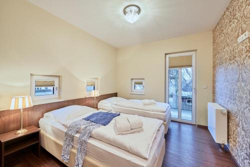 a room with two beds and a tv in it at Scharhörn-Riff - 16 in Cuxhaven