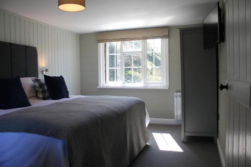 Ένα ή περισσότερα κρεβάτια σε δωμάτιο στο The Five Pilchards Inn