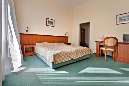 Postel nebo postele na pokoji v ubytování Spa hotel Čajkovskij