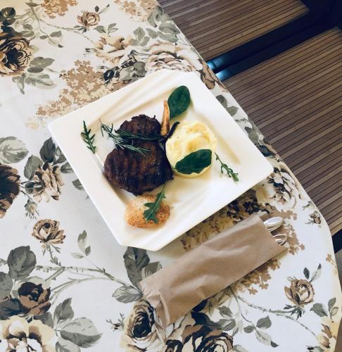 a plate of food on a table at Карпаты in Khust