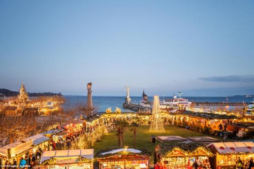 a christmas market on the beach at night at Hotel SiX in Kreuzlingen