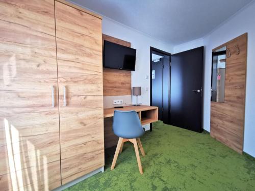TV a/nebo společenská místnost v ubytování Hotel-Pension Treppengasse Nr 6