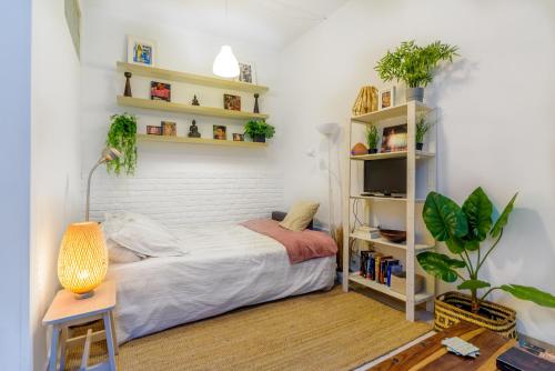 Postel nebo postele na pokoji v ubytování STYLISH LOFT AT CHUECA´S HEART