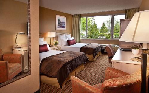 a hotel room with two beds and a window at Coast Gateway Hotel in SeaTac
