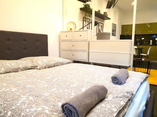 a bedroom with a bed with two towels on it at 121 Eimsbuetteler x in Hamburg