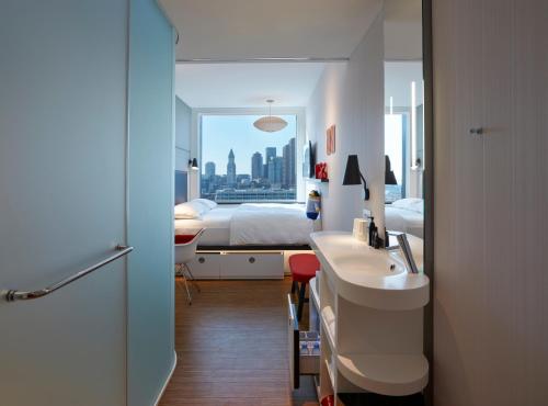 a bathroom with a sink and a toilet at citizenM Boston North Station in Boston