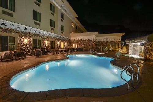 a large swimming pool in a hotel at night at Win-River Resort and Casino in Redding
