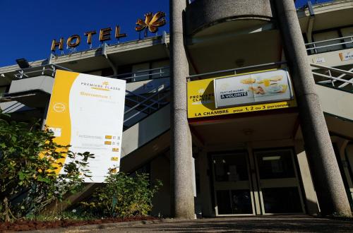 a hotel sign in front of a building at Premiere Classe Nancy Est Essey in Essey-lès-Nancy
