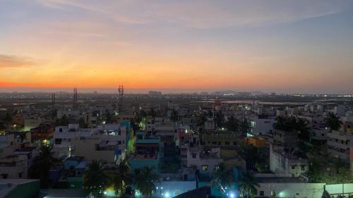 a view of a city at sunset at Holiday Inn Express Chennai OMR Thoraipakkam by IHG in Chennai