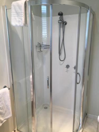 a shower with a glass enclosure in a bathroom at Sabina on Little Myers in Geelong