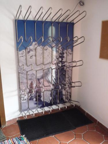 a rack of utensils in the corner of a room at B&B Landhaus Vierthaler in Filzmoos