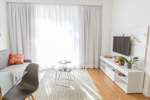 Кът за сядане в Apartamento aconchegante em Alto de Pinheiros